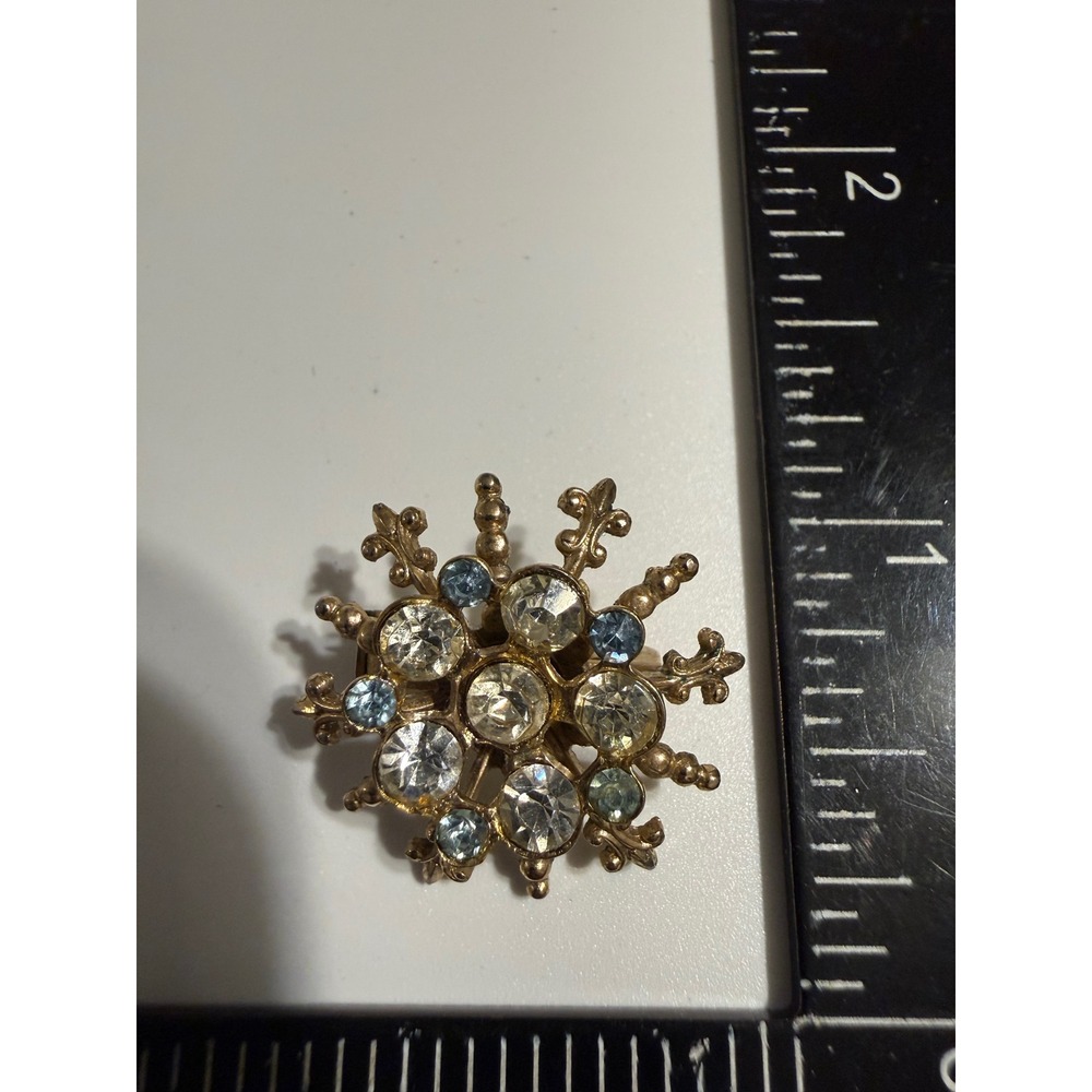 Vintage Gold Tone Sunburst Brooch Pin Clear Blue Rhinestone Starburst 1.25 Inch